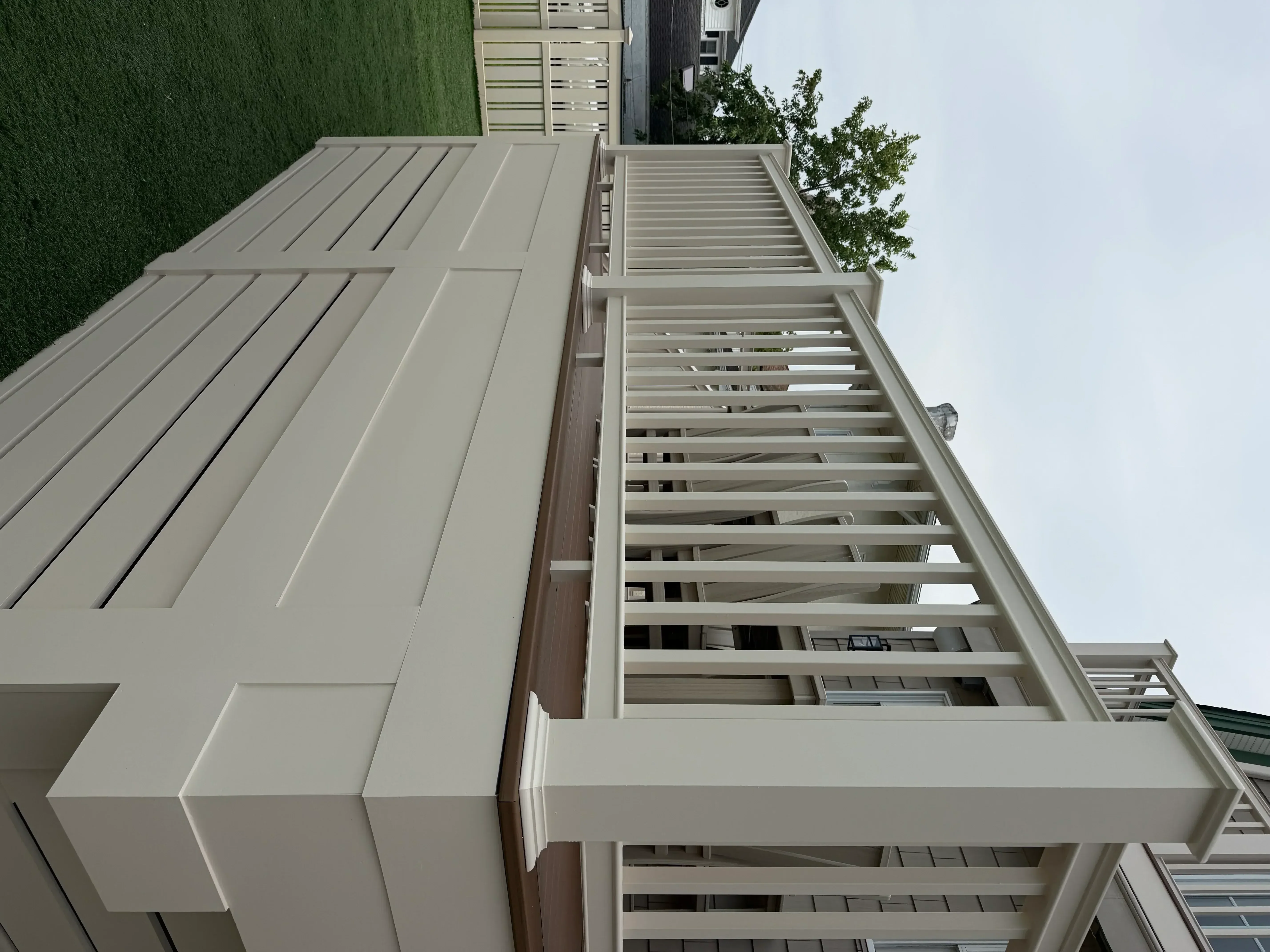 Cream and taupe painted exterior fascia, soffit, and trim on residential home